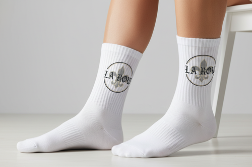 LA Row white crew socks worn on feet with logo